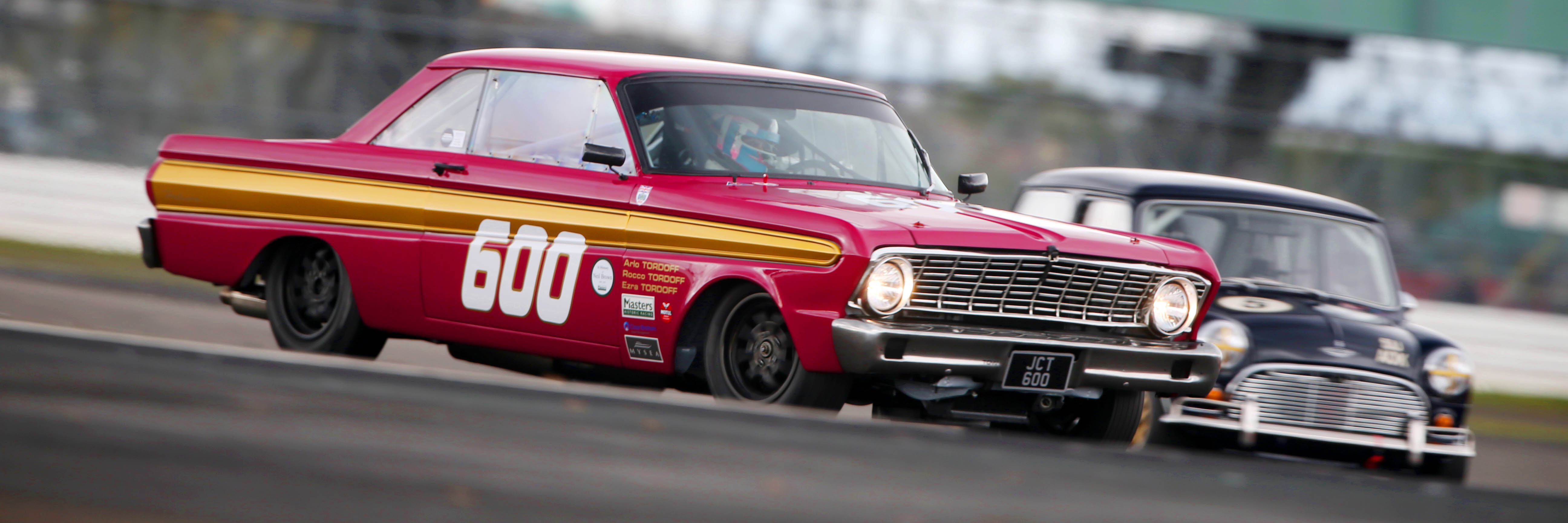 Cars racing at Silverstone Festival