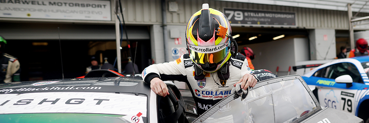 Ricky Collard climbing into his British GT race car