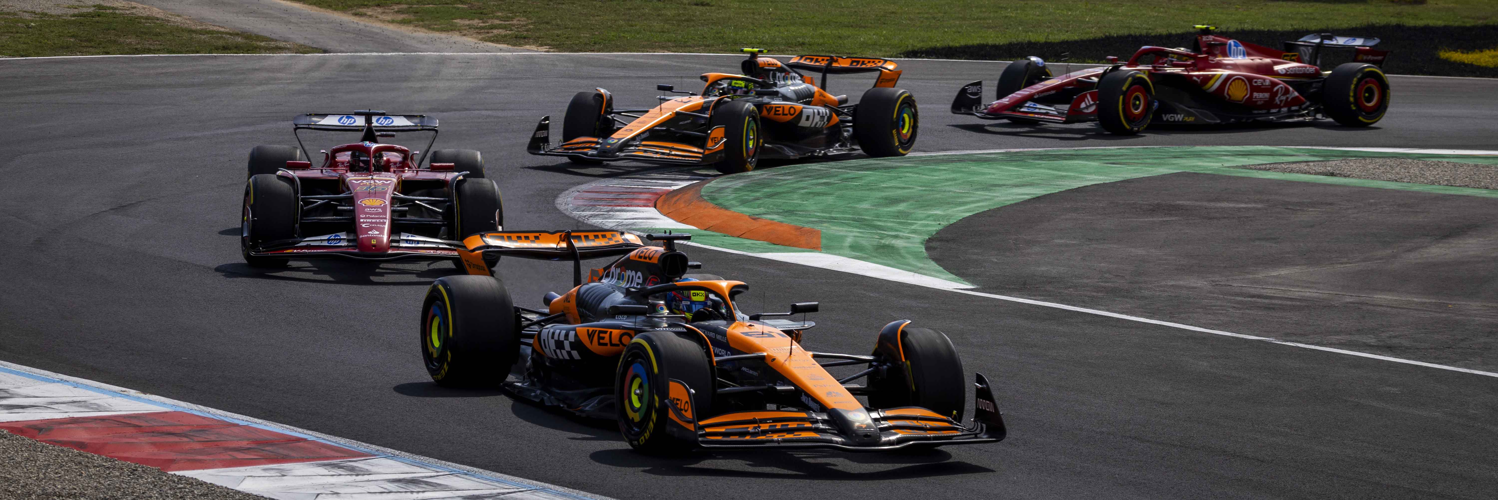 Oscar Piastri leads Charles Leclerc at Monza