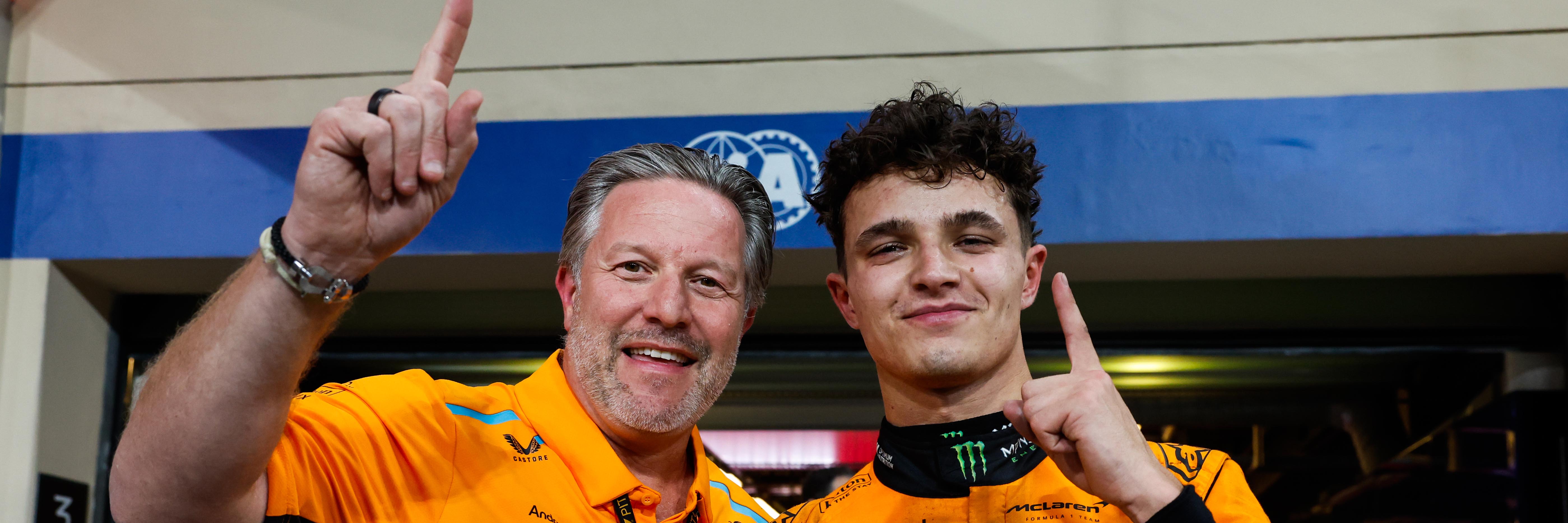 Lando Norris and Zak Brown celebrate McLaren's constructors title