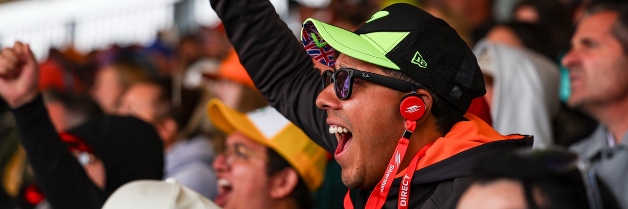 A fan enjoying the British Grand Prix from the grandstands