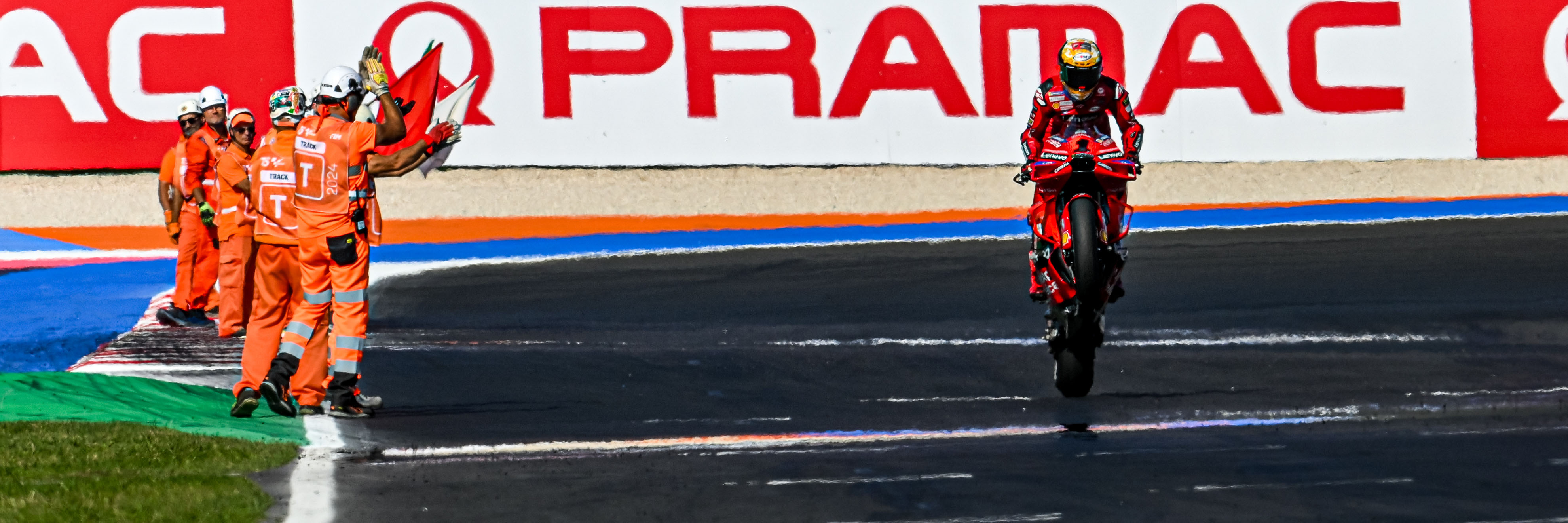 Francesco Bagnaia performs a wheelie in MotoGP