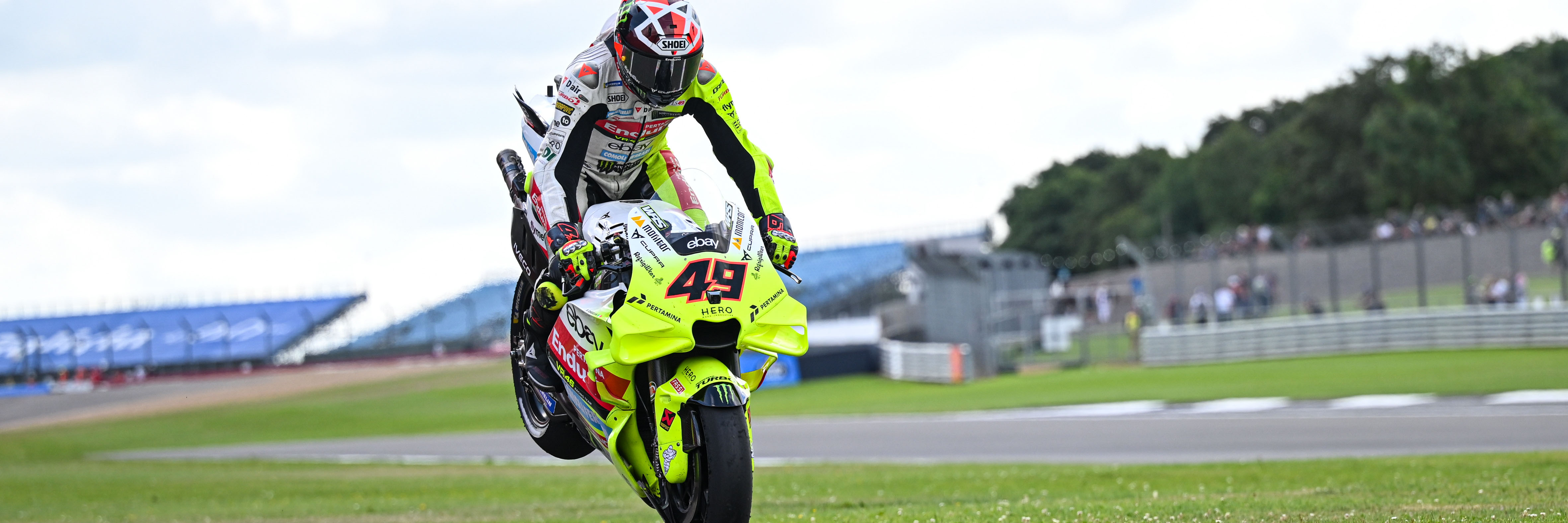 Fabio Di Giannantonio performing a stoppie at MotoGP Silverstone