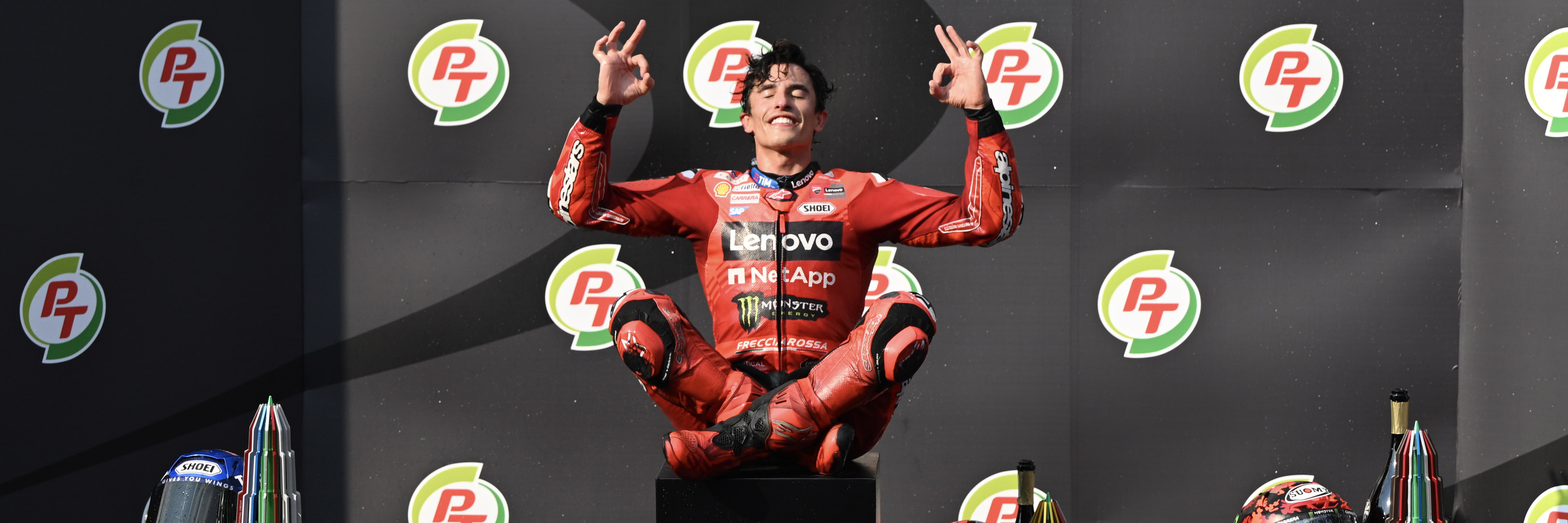 Marc Marquez celebrates winning the MotoGP Thai GP on the podium