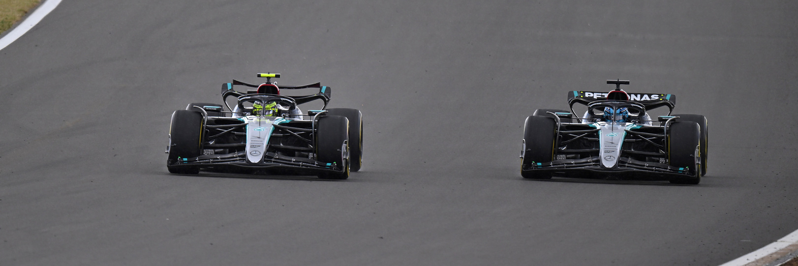 Lewis Hamilton and George Russell go side by side at Silverstone