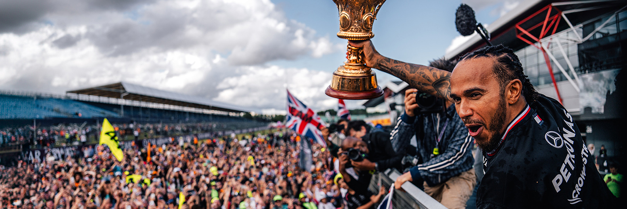 Lewis Hamilton celebrating with fans after his 2024 Silverstone victory