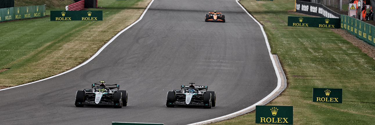 Lewis Hamilton overtaking George Russell for the lead of the 2024 British Grand Prix