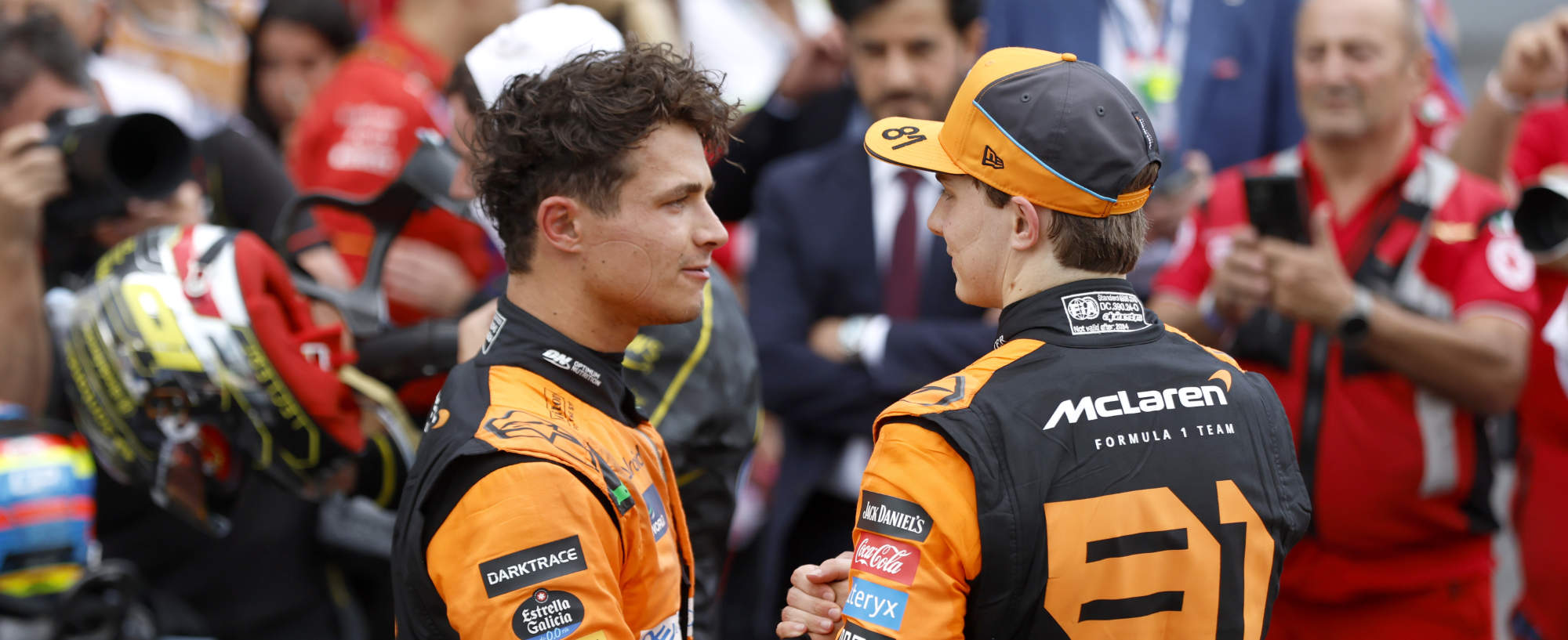 Mclaren's lando norris (L) and Oscar Piastri (R) talk to each other at the end of the race