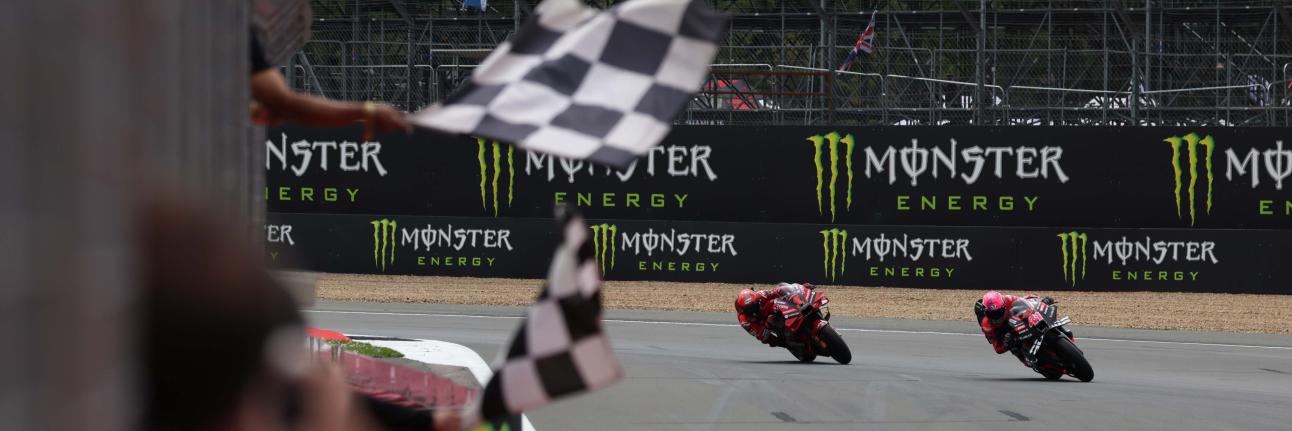 Aleix Espargaró and Francesco Bagnaia battling to the flag at the 2023 British Grand Prix