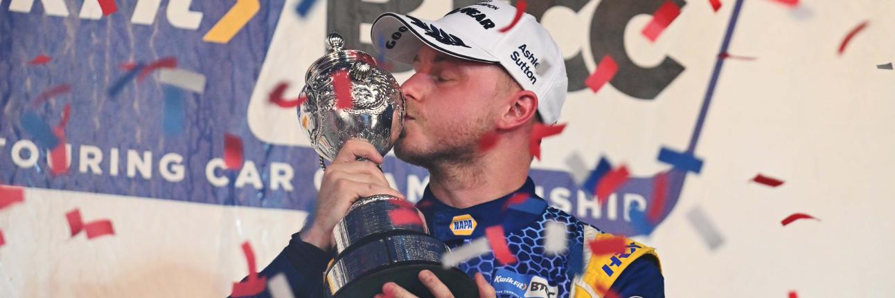 Ash Sutton with the BTCC championship trophy