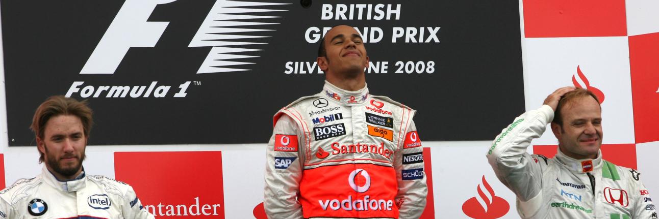 Lewis Hamilton on top of the 2008 podium at Silverstone