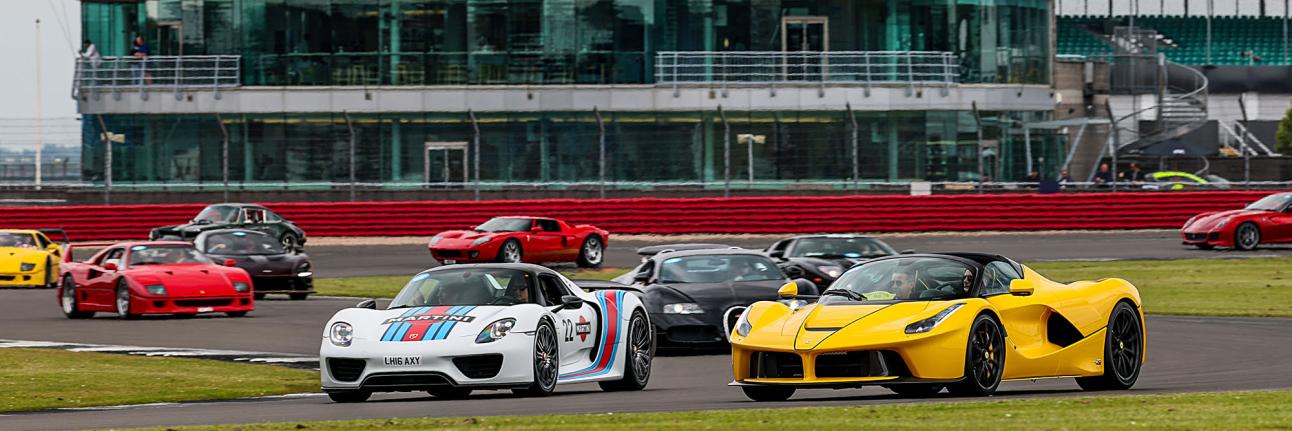 Silverstone Festival Supercars on track in front of the BRDC clubhouse