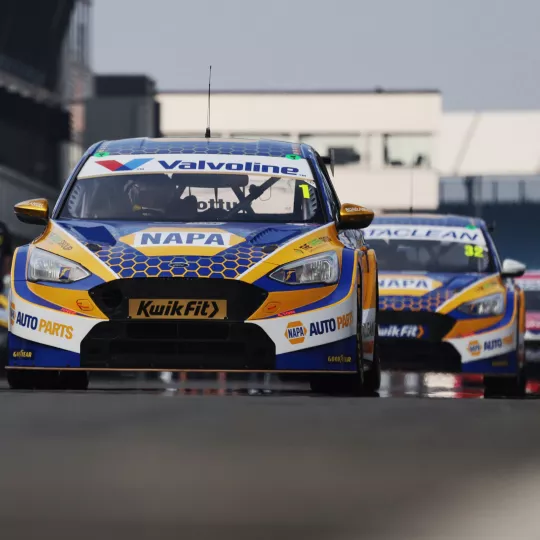 BTCC cars racing on the track at Silverstone