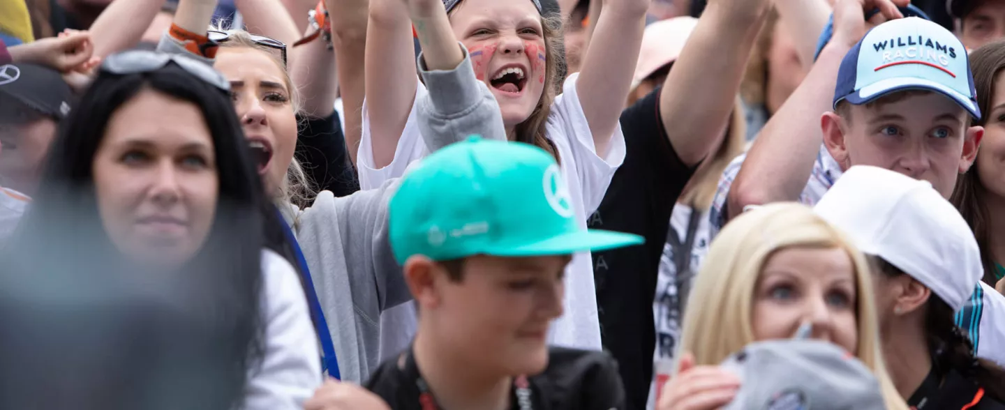 Girl cheering in the F1 crowd